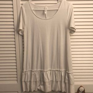Boutique white top with ruffle bottom size large